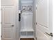 Functional mudroom with a built-in bench, storage hooks, and framed artwork at 5811 Mantle Way, Kannapolis, NC 28081