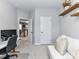 Home office features white sofa, shelving, and two entrances allowing easy access to all areas at 5811 Mantle Way, Kannapolis, NC 28081