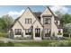 Stunning two-story brick home with symmetrical gables, lush landscaping and a welcoming front lawn at 608 Deodar Cedar Dr # 69, Matthews, NC 28104