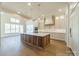 Bright kitchen featuring custom cabinets, a large island, pendant lighting and modern appliances at 608 Deodar Cedar Dr # 69, Matthews, NC 28104
