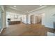 Open living space featuring hardwood floors and seamless transition to the kitchen area at 608 Deodar Cedar Dr # 69, Matthews, NC 28104
