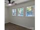 Cozy bedroom with hardwood floors, white trim, and multiple windows with natural light at 631 Chipley Ave, Charlotte, NC 28205