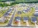 Beautiful aerial view of a neighborhood with lush greenery and well-maintained lawns at 705 Hinterland Ln, Matthews, NC 28104