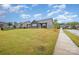 Expansive backyard view of the house, showcasing the lawn and landscaping at 705 Hinterland Ln, Matthews, NC 28104