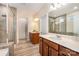 Bathroom showcasing double vanity, quartz countertops, and modern walk-in shower at 705 Hinterland Ln, Matthews, NC 28104