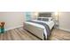 Spacious bedroom with hardwood floors, a modern bed, and neutral color palette at 705 Hinterland Ln, Matthews, NC 28104