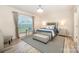 Comfortable bedroom with a stylish bed, neutral tones, and plenty of natural light at 705 Hinterland Ln, Matthews, NC 28104