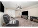 Cozy bonus room features a comfortable leather sofa and a flat screen TV at 705 Hinterland Ln, Matthews, NC 28104