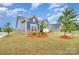 Attractive two-story home with manicured landscaping and a well-maintained lawn at 705 Hinterland Ln, Matthews, NC 28104