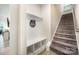 Inviting foyer featuring a built-in bench with storage and carpeted stairs at 705 Hinterland Ln, Matthews, NC 28104