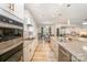 Bright, modern kitchen featuring stainless steel appliances, granite countertops, and stylish fixtures at 705 Hinterland Ln, Matthews, NC 28104