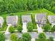 An aerial view captures a home with mature trees and manicured lawns in a suburban setting at 7101 Agnew Dr, Charlotte, NC 28273