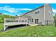 Expansive backyard featuring a well-maintained lawn, a deck, with access to the home's interior at 7101 Agnew Dr, Charlotte, NC 28273