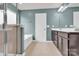 This bathroom features a tiled shower, a soaking tub and double vanity at 7101 Agnew Dr, Charlotte, NC 28273