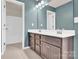 This bathroom features a double vanity, tile floors, and a separate toilet and shower room at 7101 Agnew Dr, Charlotte, NC 28273