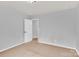 Neutral bedroom features plush carpeting, light gray walls, and a convenient ensuite bathroom at 7101 Agnew Dr, Charlotte, NC 28273