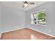 Empty bedroom with wood floors, gray walls and a ceiling fan at 7101 Agnew Dr, Charlotte, NC 28273