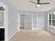 Bright bedroom features neutral paint, carpet, a ceiling fan and a window with exterior view at 7101 Agnew Dr, Charlotte, NC 28273