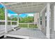 A view from the deck, showing the outdoor living space with a pergola and a manicured lawn at 7101 Agnew Dr, Charlotte, NC 28273