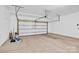 Clean, empty two car garage featuring an automatic door at 7101 Agnew Dr, Charlotte, NC 28273