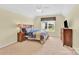 Bedroom features a window and carpet floors at 7480 Katelyn Ct, Harrisburg, NC 28075