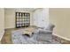 Bonus room features a charming sitting area with storage and decor at 7480 Katelyn Ct, Harrisburg, NC 28075