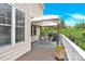 Outdoor deck featuring a canopy, grill, and comfortable seating area at 7480 Katelyn Ct, Harrisburg, NC 28075