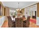 Formal dining room with stylish chairs, a round table, and view to other rooms at 7480 Katelyn Ct, Harrisburg, NC 28075