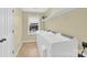 Functional laundry room with modern appliances and storage shelves at 7480 Katelyn Ct, Harrisburg, NC 28075