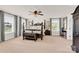 Spacious main bedroom features large windows and a ceiling fan at 7480 Katelyn Ct, Harrisburg, NC 28075