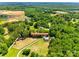 Expansive wooded acreage at 7712 Old Waxhaw Monroe Rd featuring a long driveway and pastures with mature trees at 7712 Old Waxhaw Monroe Rd, Waxhaw, NC 28173