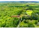 Aerial view of a secluded property at 7712 Old Waxhaw Monroe Rd surrounded by lush trees and fields at 7712 Old Waxhaw Monroe Rd, Waxhaw, NC 28173