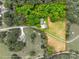 Aerial view of a large property with wooded areas and open land, outlined with property lines for clarity at 7712 Old Waxhaw Monroe Rd, Waxhaw, NC 28173