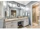 Bright bathroom features double sinks, granite counters, and a glass-enclosed shower, offering a spa-like experience at 7712 Old Waxhaw Monroe Rd, Waxhaw, NC 28173