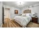 Tranquil bedroom with soft lighting, decorative headboard and elegant decor at 7712 Old Waxhaw Monroe Rd, Waxhaw, NC 28173
