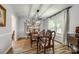 Dining room with wooden table, elegant chairs, and decorative hutch at 7712 Old Waxhaw Monroe Rd, Waxhaw, NC 28173