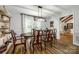 Dining room with wooden table, elegant chairs, and modern lighting at 7712 Old Waxhaw Monroe Rd, Waxhaw, NC 28173