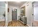 Welcoming entryway featuring hardwood floors, stylish console table, and modern decor at 7712 Old Waxhaw Monroe Rd, Waxhaw, NC 28173