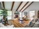 Cozy living room featuring a fireplace, vaulted ceiling and hardwood floors at 7712 Old Waxhaw Monroe Rd, Waxhaw, NC 28173
