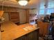 A basement with a stained glass light, wood shelves, and some supplies at 804 Dennis St, Troy, NC 27371