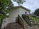 Exterior of a home with a stairway that leads to a door on a cloudy day at 804 Dennis St, Troy, NC 27371