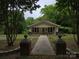 Inviting home with a walkway, front porch, and charming curb appeal at 804 Dennis St, Troy, NC 27371