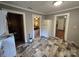 Kitchen with views into other rooms, offering a light colored refrigerator and tile floors at 804 Dennis St, Troy, NC 27371