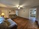 Spacious living room featuring hardwood floors and access to the kitchen at 804 Dennis St, Troy, NC 27371
