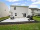 Generous concrete patio in backyard features a barbecue, perfect for outdoor gatherings at 8314 Paw Valley Ln, Charlotte, NC 28214