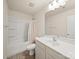 Neutral bathroom features a vanity with a sink, toilet, and shower/tub combo at 8314 Paw Valley Ln, Charlotte, NC 28214