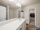 Bright bathroom with a large mirror, vanity, and linen closet in view at 8314 Paw Valley Ln, Charlotte, NC 28214
