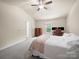 Comfortable bedroom with carpeted floors, closet and natural light from the windows at 8314 Paw Valley Ln, Charlotte, NC 28214