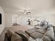Large open concept living space flowing to kitchen and dining areas, showcasing a fan at 8314 Paw Valley Ln, Charlotte, NC 28214