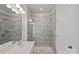Modern bathroom featuring a glass-enclosed shower with tiled walls at 9110 Buckley Ct # 154, Charlotte, NC 28269